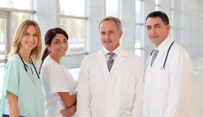 Team of healthcare professionals in a modern medical office — E-Billing and Consulting Inc